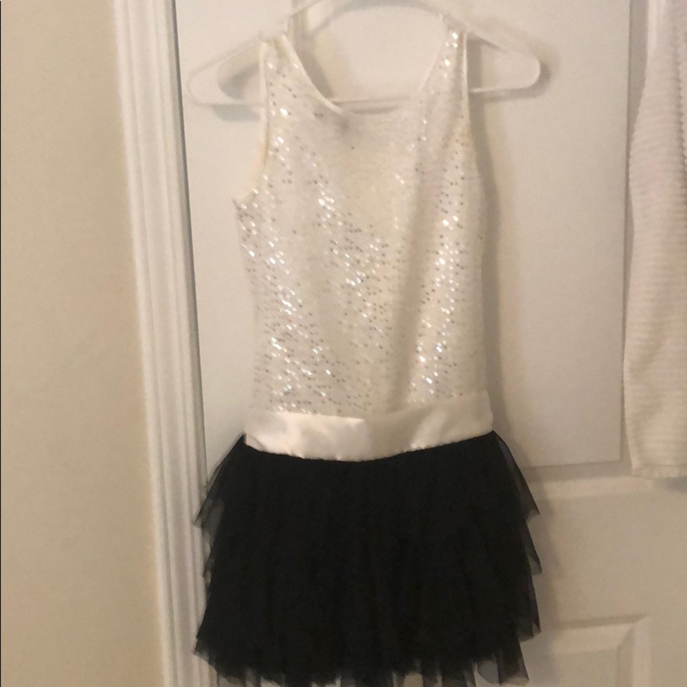 White sparkly top black layered frill bottom